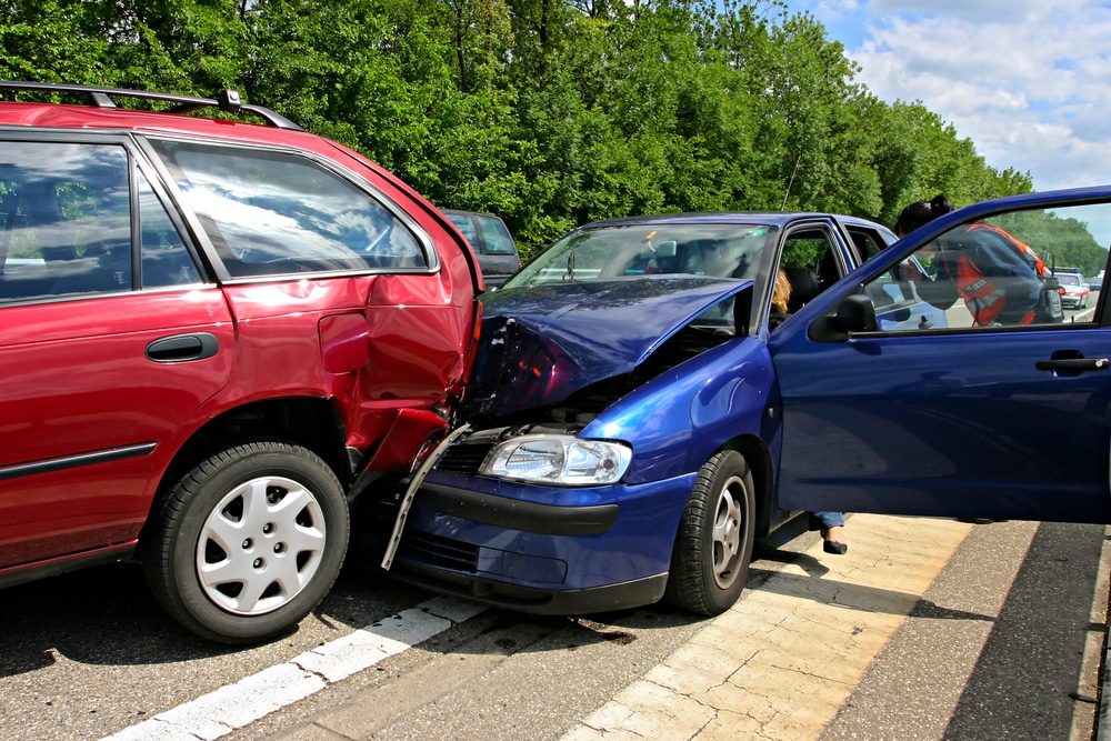 Car collision on the road, front-end crash