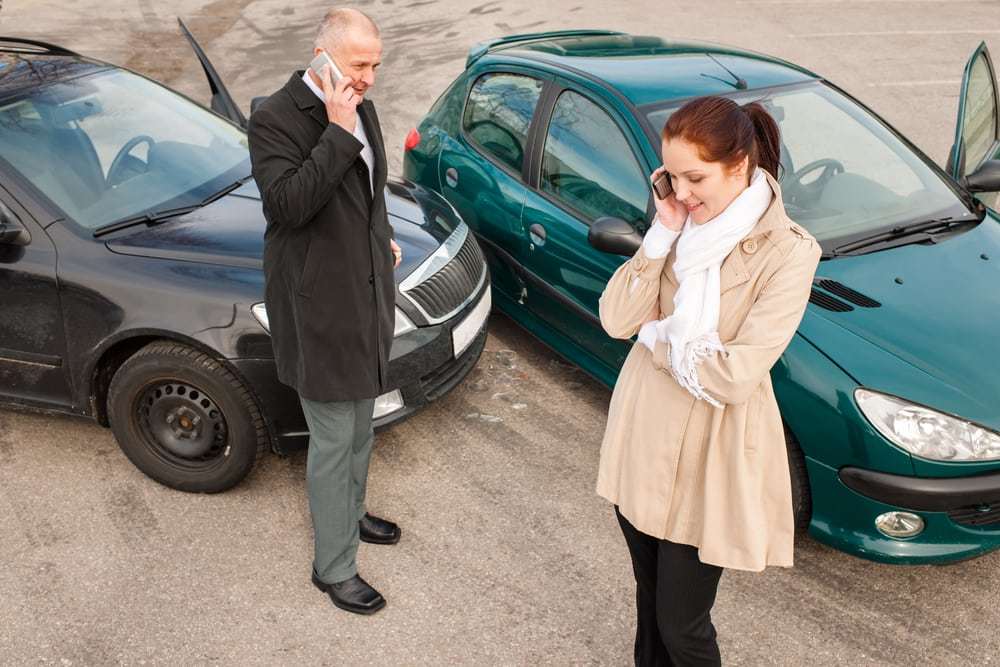 Woman and man on phone car crash accident calling problem