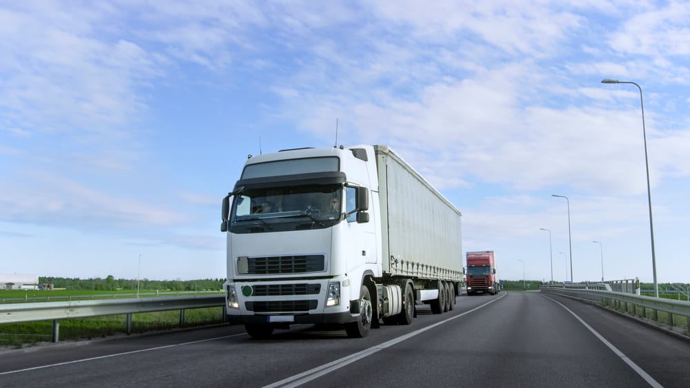 Two-tractor-trailer-trucks-on-the-highway