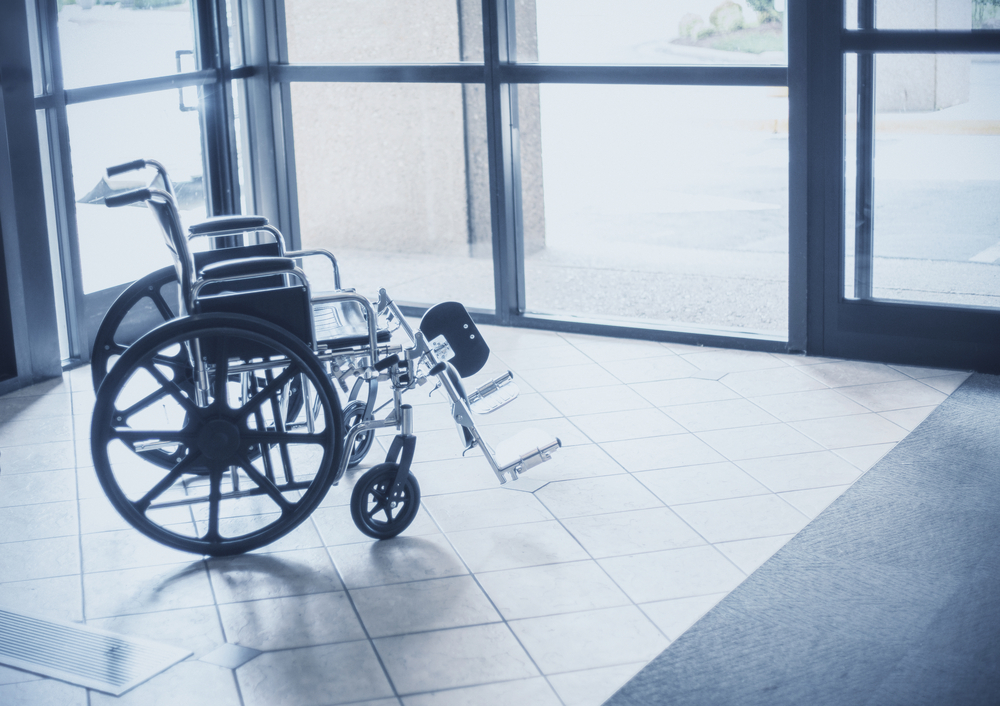 Wheelchair near windows and door
