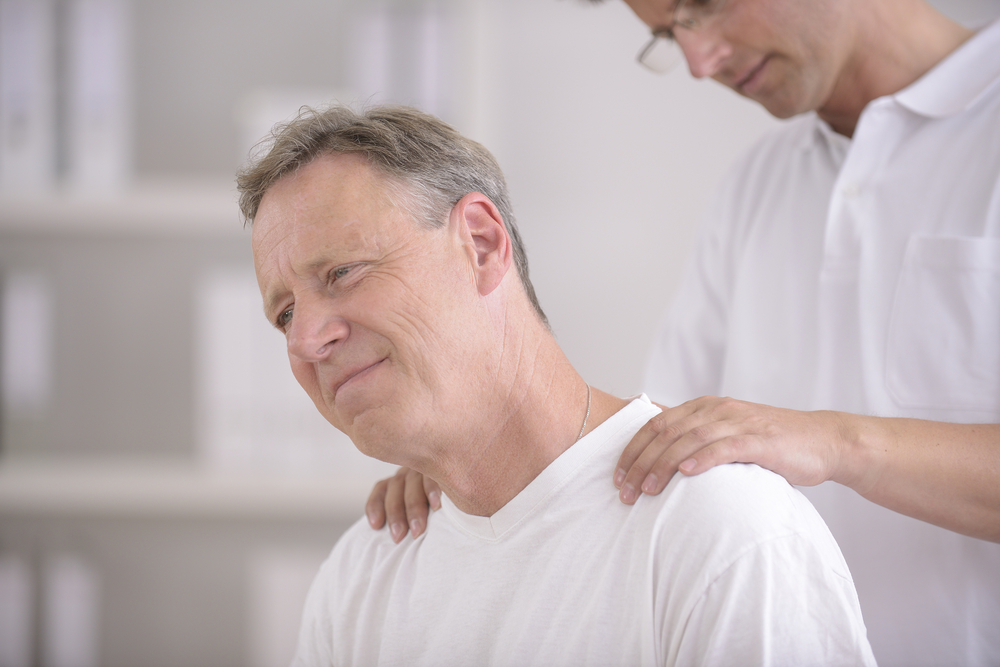 Man with neck injury at doctor's office