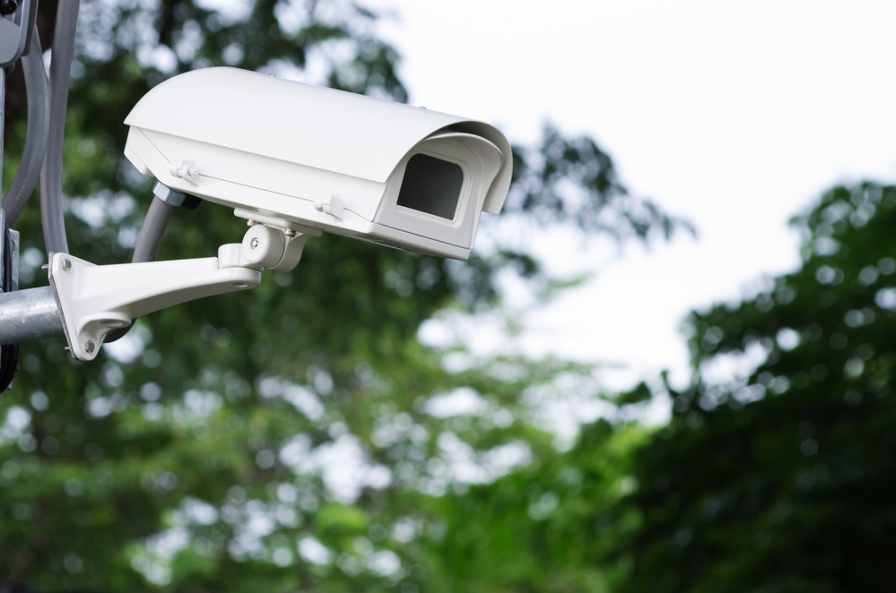 Traffic camera, trees in the background