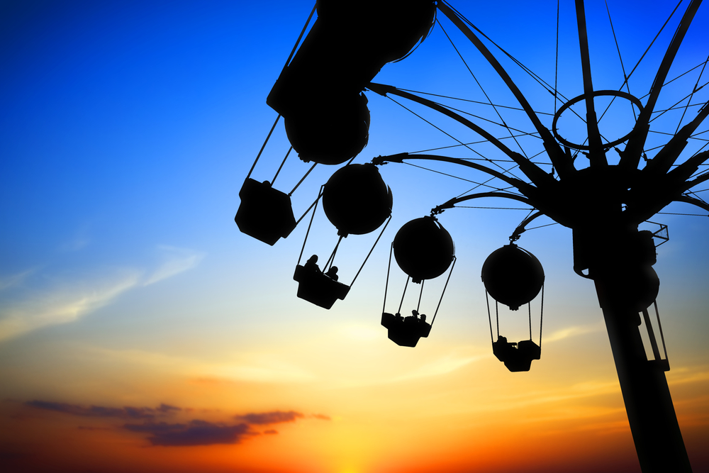 amusement park ride silhouette at sunset