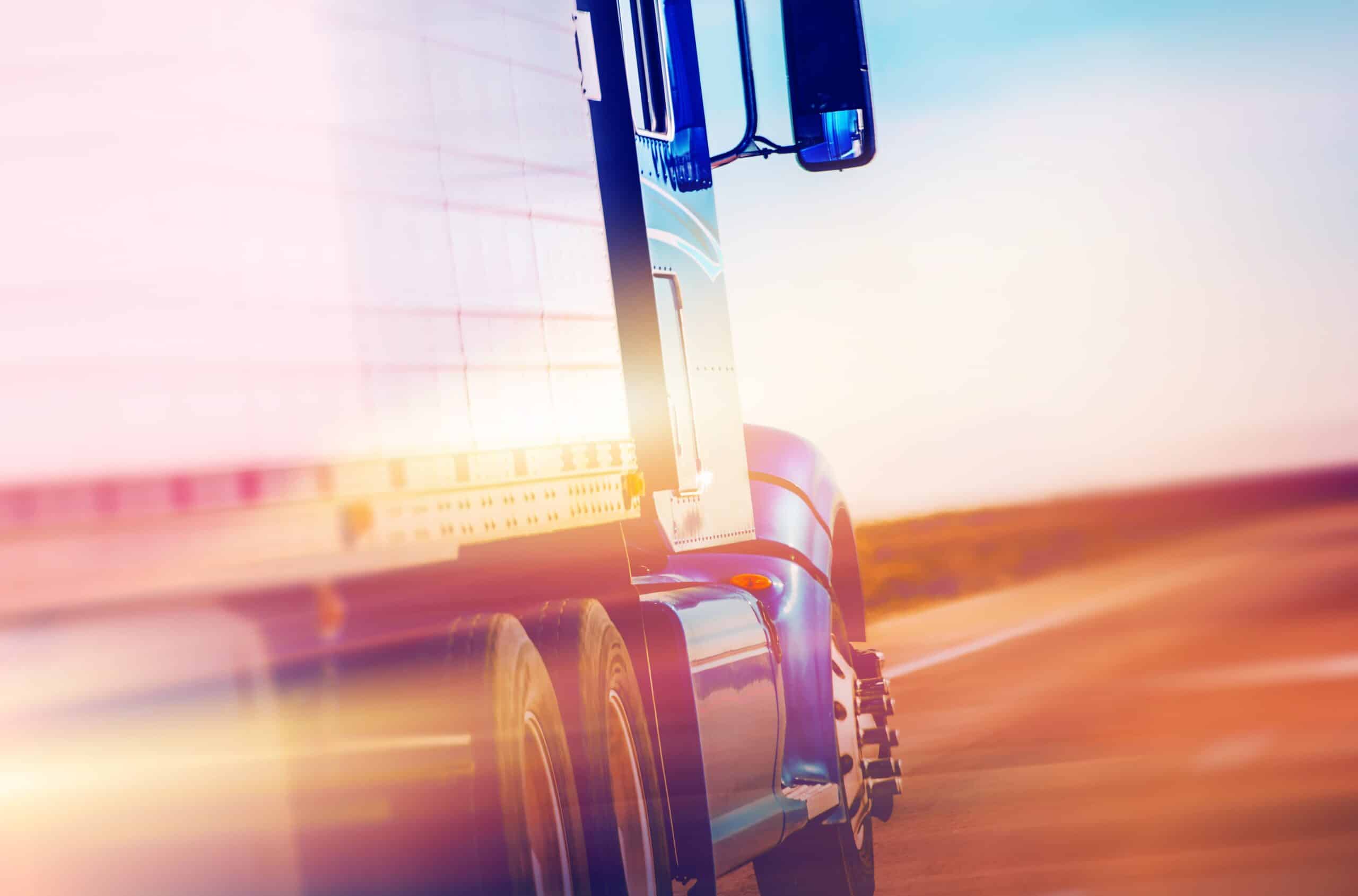 Close-up of side of semitruck at sunset