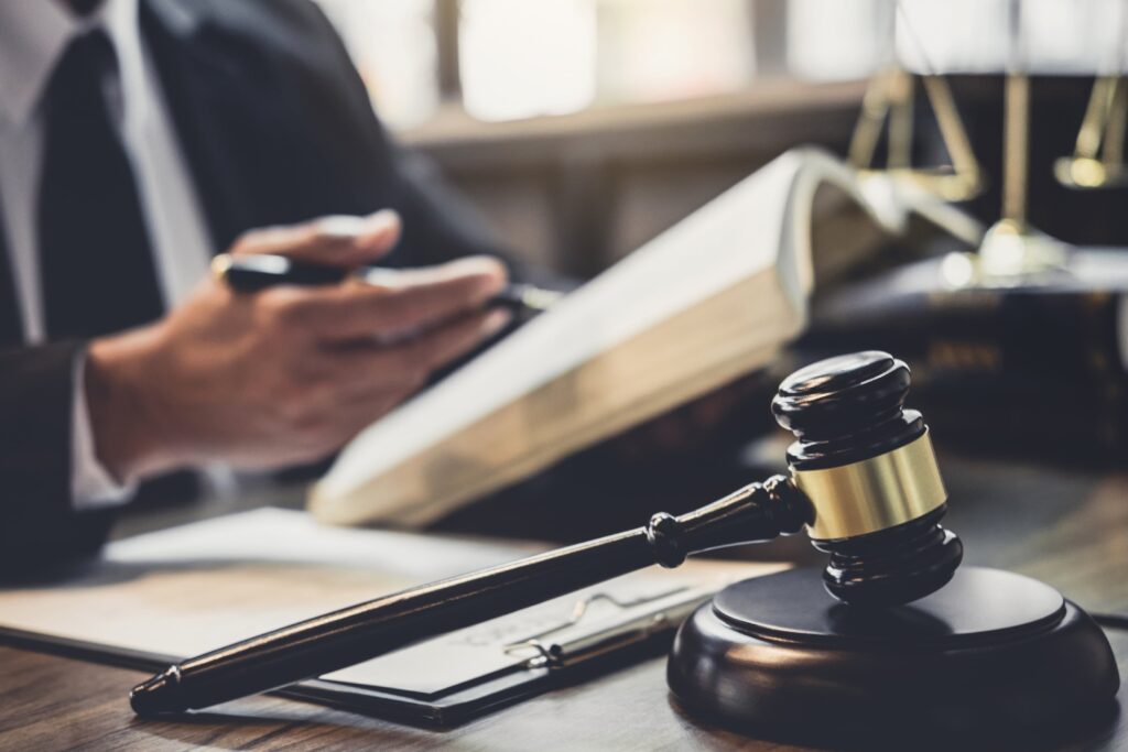 Close-up of lawyer, gavel, book