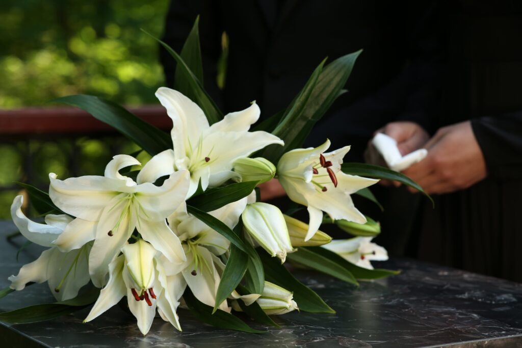 Flowers on top of a casket