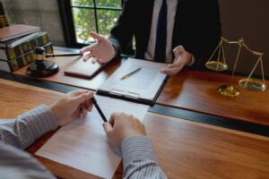Lawyer talking to client over desk, cropped