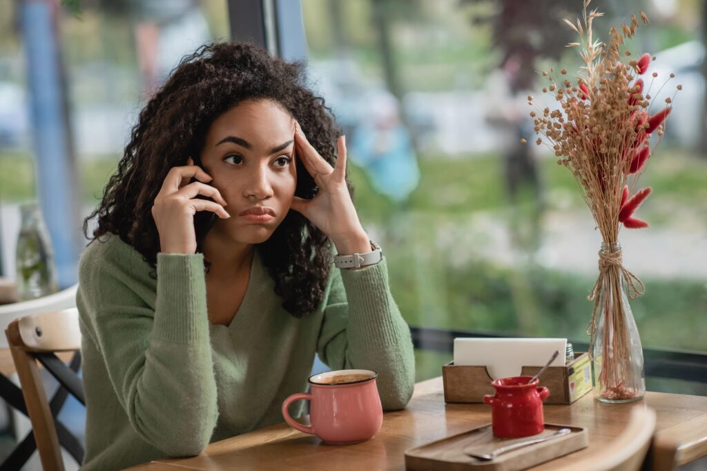 Upset woman talking on phone