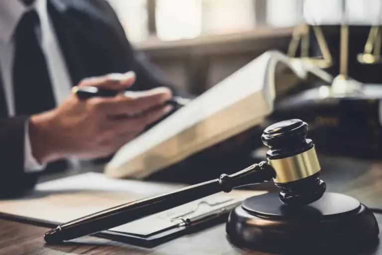 Close-up of lawyer gavel book